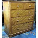 A Victorian satin birch bedroom chest of two short over three long graduated drawers flanked by
