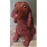 A novelty reclaimed garden ornament in the form of a seated spaniel with glazed finish, 36cm high