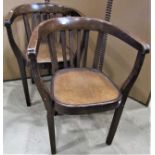 A pair of vintage stained bentwood tub chairs with paper label to inner seat rail, Fischel