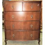 A walnut veneered bow fronted bedroom chest of two short over three long drawers raised on short