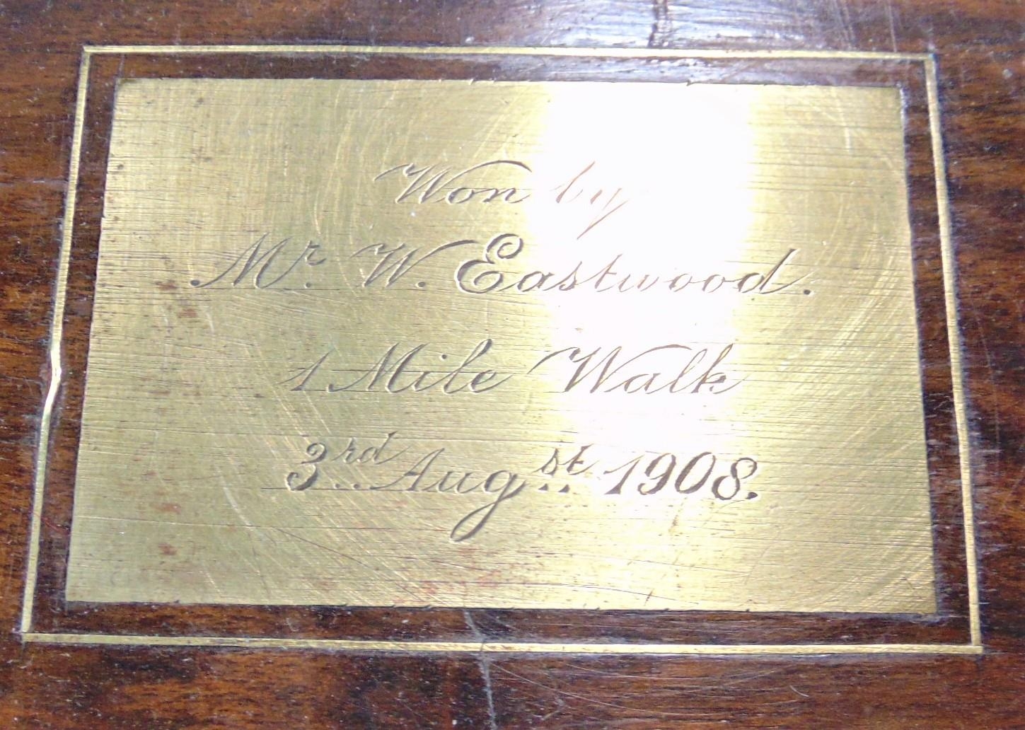 An early 20th century burr walnut brass bound writing slope, brass plaque applied to the hinged - Image 2 of 3