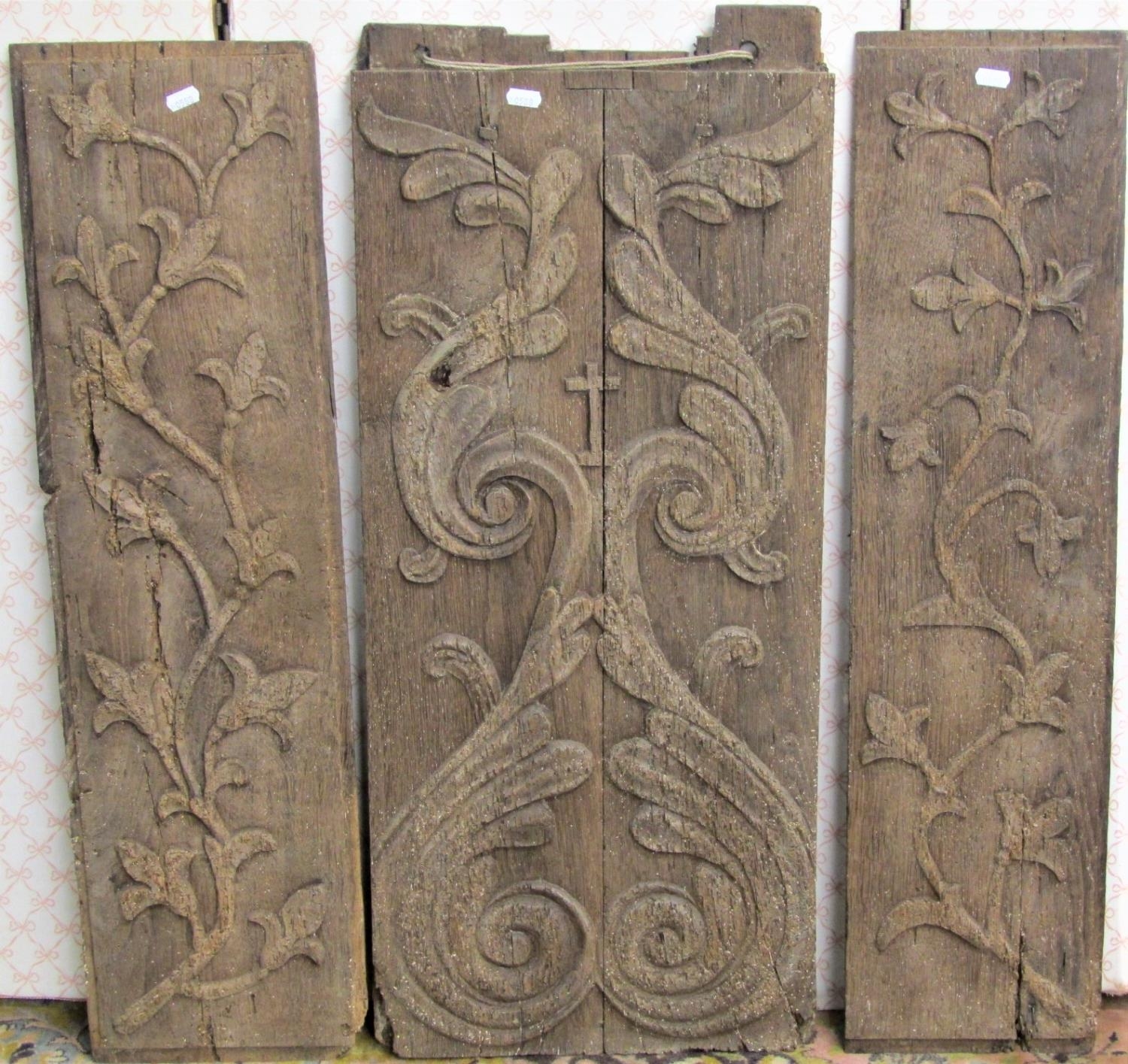 Three 18th century scumbled oak panels with trailing floral detail