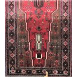 Good quality Kurdie runner decorated with various central medallions and still life's upon a red