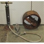 An old vintage heavy duty brass cylinder pump with turned T shaped handle and pierced circular