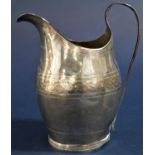 Georgian silver baluster cream jug engraved with a plaited band and blank shield crest, hallmarks