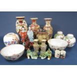 A quantity of oriental ceramics including a set of three graduated ginger jars and covers (one cover