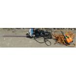 A Mallister 710w electric hedge trimmer with 70 cm blade together with an extension lead with