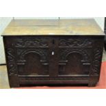 A 17th century oak coffer, the front elevation enclosing two arcaded panels with floral marquetry