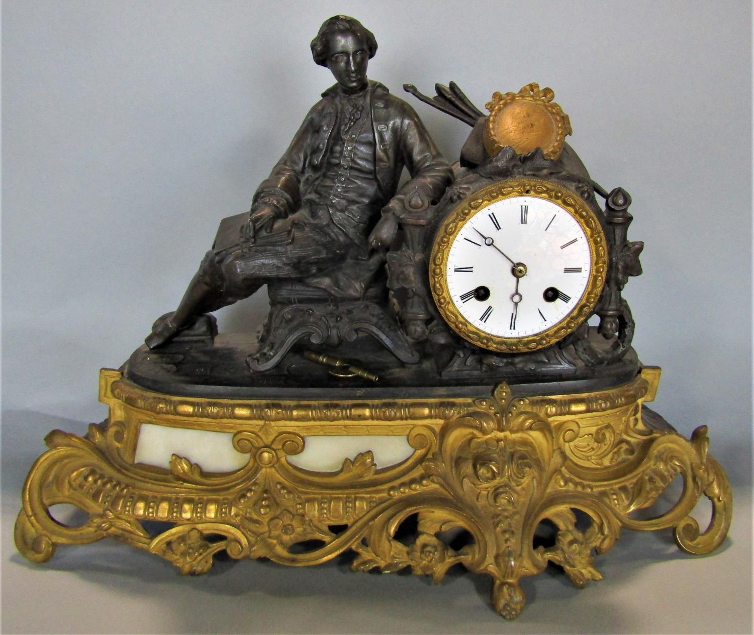 19th century French mantel clock in the romantic style, the eight day sticking movement surmounted