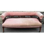 An Edwardian parlour/drawing room low two seat sofa with upholstered seat and curved back rail, with