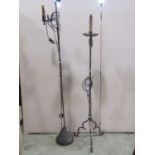 An old English style ironwork standard lamp together with one other in the gothic manner (2)