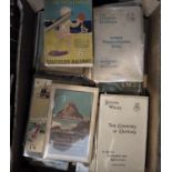 Two boxes containing a quantity of railway related books and vintage UK holiday guides produced by