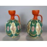 A pair of mid-Victorian period ovi-form vases with repeating geometric detail, with orange necks and