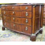An 18th century Dutch commode of four long graduated drawers, with shaped front within fluted column