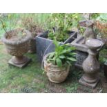 Three reclaimed garden planters of varying size and design with relief detail, together with two