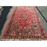 Good quality full pile Qashgai carpet with intricate stylised still life decoration around a central