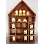 A collection of fourteen miniature brass cased mantel clocks of varying design by Park Lane,