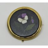 Antique yellow metal pietra dura pansy brooch of circular form, inscribed to reverse 'Given to my