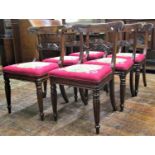 A decorative set of six Regency dining chairs in beechwood with carved and pierced splats, the