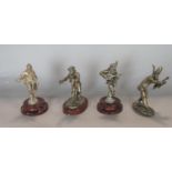 Four 19th century silver plated figures, humorous musician and swordsman, three on turned marble
