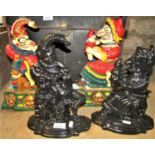 A pair of heavy cast iron door porters in the form of Punch and Judy with brightly painted finish,