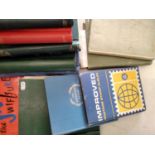 A collection of various stamp albums containing a mixture of British and worldwide stamps -