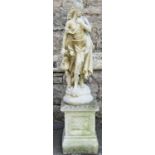 A small reclaimed garden statue in the form of a standing classical maiden/watercarrier, 65cm high