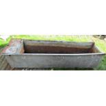 A reclaimed field water trough of rectangular form with tubular rim (af) approx 190cm long x 50cm