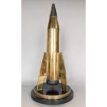 Trench Art Interest - An artificer-art brass model of a stylized rocket, the base marked 'Presented
