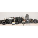 A number of vintage cameras including a Zenit-E 11, a Lumicon cine camera and film, a Hanimex