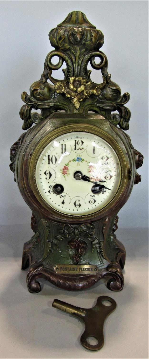 Late 19th century French painted spelter mantel clock, the casework with dolphin, floral, scroll and