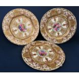 A set of three good quality Royal Worcester cabinet plates with central floral panels painted by E