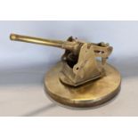 Trench Art Interest - An artificer-art brass model of a Deck Gun, raised on a circular plinth, with