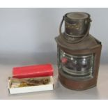 Vintage copper port marine lantern and a Bosun's whitsle