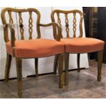 A set of nine (7+2) dining chairs in maple, with bullseye splats and upholstered seats, raised on