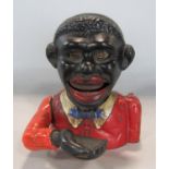 A vintage cast iron money box - Little Joe with original painted finish