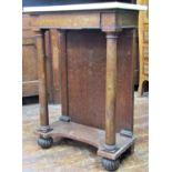 A Regency mahogany pier table raised on a pair of column supports with enclosed back on fluted feet,
