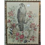A framed and glazed tapestry of a hawk perched on a branch with foliate detail, 75cm x 57cm