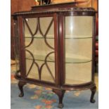 An Edwardian mahogany shallow break and bow front side cabinet with gadroon and moulded framework,