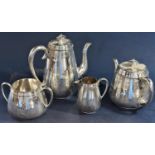 A good quality Elkington silver plated baluster four piece tea service with faceted engraved Islamic