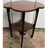 An Edwardian mahogany centre table, the shaped top raised on four shaped supports with inlaid