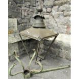 A Victorian copper lantern hood frame and associated wrought iron wall mounted/inserted bracket, the