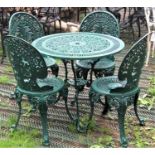 Green painted cast aluminium garden terrace table of circular form with decorative pierced tudor