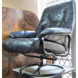 A Swedish swivel lounge chair with soft black leather upholstery, tubular frame and hoop base (