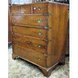 A reproduction yewwood venereed chest of four long and three short graduated drawers with military
