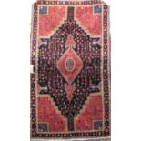 Good quality Toserkan rug with central floral medallion framed by further still life's upon a blue