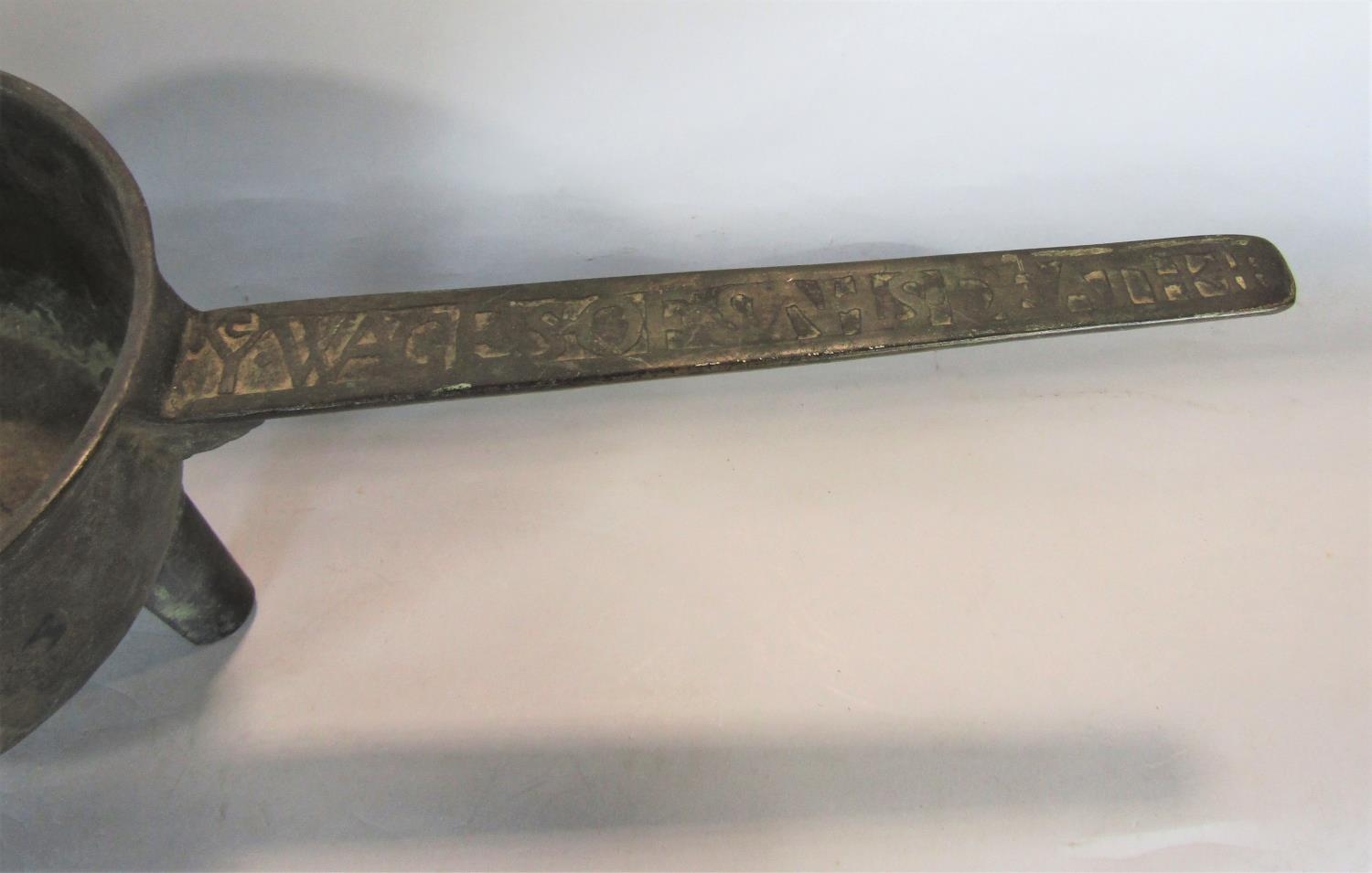 An 18th century bell metal skillet, the handle with script 'Ye Wages Of Sin Is Death' - Image 2 of 2