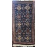 Two old Balouchi rugs with typical medallion decoration upon a navy blue ground, 150 x 75 cm and 120