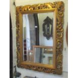 A large antique style wall mirror of rectangular form with bevelled edge plate, within a stepped and
