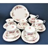 A collection of Royal Albert Lavender Rose pattern tea wares comprising milk jug, sugar bowl, cake